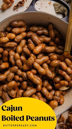 a pan filled with boiled peanuts on top of a table