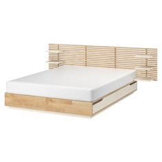 a bed with wooden slats and white sheets