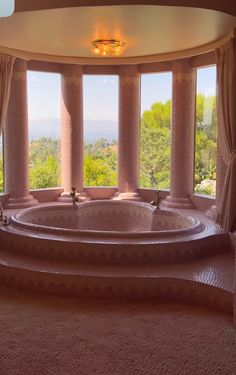 a large bath tub sitting in the middle of a room