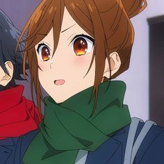 an anime character with long hair and brown eyes wearing a green scarf, looking at the camera