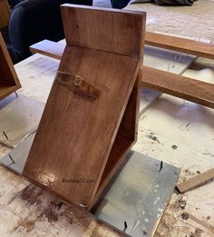 a piece of wood sitting on top of a wooden table