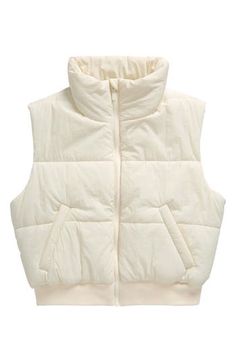 Lofty insulation keeps your child warm in this puffy vest finished with a stretchy ribbed hem that helps seal out the cold. Front zip closure Stand collar Front welt pockets Lined, with 100% polyester fill 100% nylon Machine wash, line dry Made in China Short Puffer Vest, Cropped Puffer Vest, Winter Puffer Vest, Puffer Vest Jacket, Sleeveless Puffer, Wide Leg Lounge Pants, Bodycon Sweater, Womens Puffer Vest, Quilted Puffer Vest