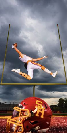 a football player jumping up into the air with a helmet on his feet in front of him