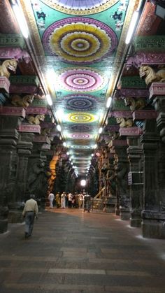 the inside of a building with many colorful designs on it's walls and ceiling