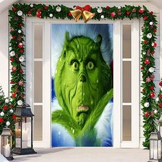 the grinch door cover is decorated with christmas decorations