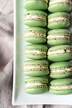 green macarons are stacked on top of each other with the words homemade pistachio macaroons above them