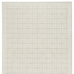 a white rug with squares and lines on the floor in front of a white background