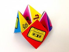 an origami toy with various objects on it