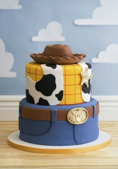 this is a cake made to look like a toy story woody the cowman costume