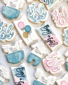 decorated baby shower cookies on a table