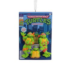 teenage mutant ninjas keychain with two turtles hanging from it's front