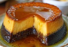 a cheesecake on a plate with caramel sauce