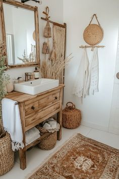 a bathroom with a sink, mirror and rug