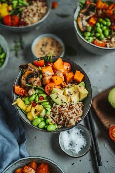 several bowls filled with different types of food