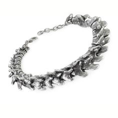 Show off your rock and heavy metal style with this unique unisex vertebrae bracelet. crafted from premium pewter, this bracelet is the perfect accessory to complete any outfit. get yours now! Alchemy Gothic, Bones Bracelet, Dope Jewelry, Safety Chain, Iron Maiden, Memento Mori, Gothic Jewelry, Hinged Bangle, Sea Glass Jewelry