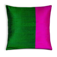 a green and pink pillow on a white background with the same color as it is