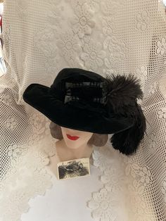 Edwardian 1910's Black velvet hat with genuine ostrich plumes. Also adorned with Black beads. Is lined with fabric. No makers label or tags. The hat comes with a photo of the original owner of the hat. She is NOT wearing this particular hat in the photo.  *SCROLL DOWN FOR CONDITION & MEASUREMENS* CONDITION: No issues noted. MEASURES: Inside circumference~24" Height~3" Front to back~8" Left to right~7 1/2" *WE APOLOGIZE~BUT WE NO LONGER SHIP TO GERMANY, ITALY OR SPAIN. IF ORDERS COME IN FROM GERMANY, ITALY OR SPAIN, WE WILL HAVE TO CANCEL THEM AND REFUND YOUR MONEY. SORRY FOR THIS INCONVENIENCE* Victorian Short Brim Hat For Vintage Events, Victorian Costume Hat With Curved Brim, Vintage Fur Felt Hat Bands For Kentucky Derby, Vintage Brimmed Top Hat For Costume, Vintage Short Brim Top Hat For Costume, Formal Hat With Feather Trim, Formal Costume Hats With Feather Trim, Formal Costume Hats And Headpieces With Feather Trim, Formal Short Brim Hat With Feather Trim