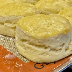 several biscuits sitting on top of an orange plate