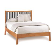 a wooden bed with white sheets and pillows on it's headboard, against a white background