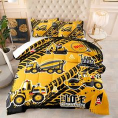 a bed covered in yellow and black construction themed comforter sets with matching pillow cases