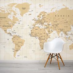 a chair sitting in front of a wall with a map on it