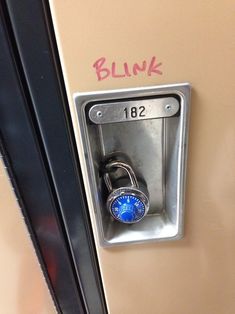 a lock on a door with the word blink written on it and an image of a padlock