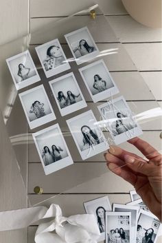 a person holding up some pictures in their hand