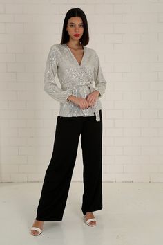 "The white sequined wrap blouse has a modern and stylish look. Our glamorous blouse with its sparkle is an extremely stylish and elegant choice for formal evenings such as cocktails, weddings and all-night/day invitations. The blouse, which is a coupon piece that you should have in your closet, can be combined with sequined twin trousers, baggy and tight classic trousers or jeans. It easily adapts to your body with the shawl model. It is tied around the waist with a belt. S/36 Length from underarm: 43cm/16.9\" Length from Shoulder: 66cm/25.9\" M/38 Length from underarm: 44cm/17.3\" Length from Shoulder: 67cm/26.4\" L/40 Length from underarm: 45cm/17.7\" Length from Shoulder: 68cm/26.8\" XL/42 Length from underarm: 46cm/18.1\" Length from Shoulder: 69cm/27.2\" 2XL/44 Length from armpit: 47c Glamorous Formal V-neck Blouse, Festive V-neck Evening Blouse, Glamorous V-neck Blouse, V-neck Sequin Blouse For Night Out, Elegant Fitted V-neck Sequin Fabric, Glamorous Sequin Fabric For Festive Formal Occasions, Elegant Long Sleeve Tops With Contrast Sequin, Elegant V-neck Blouse For Party Season, Glamorous V-neck Blouse For Formal Occasions