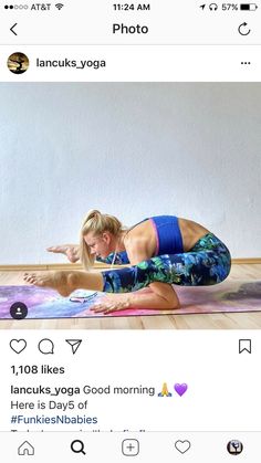 a woman is doing yoga on her phone