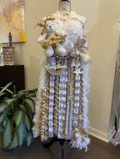 a dress made out of ribbons and teddy bears