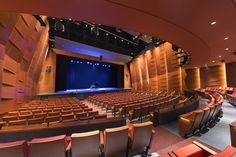 an empty auditorium with rows of seats