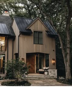 a house that is surrounded by trees and plants