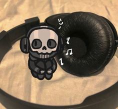 a pair of headphones sitting on top of a table next to a sticker