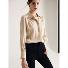 Discover Elegance and Comfort Elevate your wardrobe with our Elegant Long Sleeve Silk Blouse, a perfect blend of luxury and practicality for the modern woman. Designed for all-season wear, this blouse is a testament to timeless style and comfort. Its solid purple hue and chic design make it an ideal choice for a sophisticated office look or a casual day out. Premium Quality Fabric Experience the luxurious touch of our blouse, crafted with a high-quality blend of 90% Mulberry silk and 10% Spandex. This exquisite combination ensures both comfort and durability, offering a slight stretch for the perfect fit. The thin, breathable fabric makes it suitable for any season, providing a seamless blend of warmth and coolness. Key Features Fabric Content: 91% to 95% natural fiber, ensuring a gentle f Elegant Semi-formal Tops With Lapel Collar, Modern V-neck Blouse For Fall, Classic V-neck Blouse For Semi-formal Occasions, Timeless Office Blouse With Lapel Collar, Timeless Button-up Blouse For Business Casual, Timeless Button-up Office Tops, Timeless Collared Blouse For Work, Timeless Fall Button-up Tops, Versatile Fall Business Casual Shirt