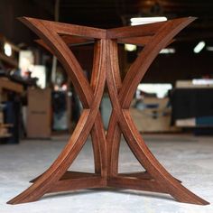 a wooden table sitting in a room with lots of woodwork on the walls and floor