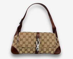 Brand - Gucci Model - Jackie O Flap Era - 2000s Origin - Made in Italy Measurements - 29,5*15*1,5cm Exterior Material - canvas & leather Interior Material - textile Color - beige & brown Color of the hardware - grey Details - Inside pocket × 1 Serial code - 90667 000926 Condition - very good, no defects Please note that vintage items are not new, but have a history that makes them so special. That is why some of them may show signs of wear. We always indicate the condition of the items in the de Rectangular Canvas Shoulder Bag With Logo Hardware, Casual Rectangular Shoulder Bag With Logo Hardware, Beige Brown Color, Gucci Model, Gucci Monogram, Gucci Models, Jackie O, Beige Brown, Vintage Bags