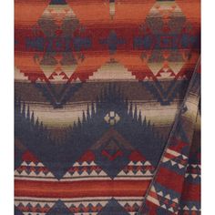 an orange, blue and red sweater with geometric designs on the front that says made in america