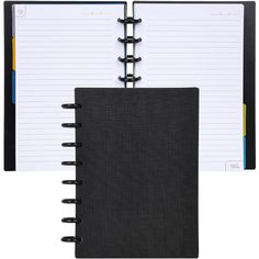 a black notebook is open on top of a white background