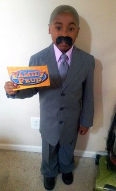 a man in a suit and tie holding up a box with an ad on it