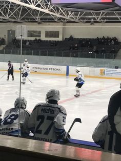 the hockey players are playing on the ice rink as people watch from the stands in the bleachers