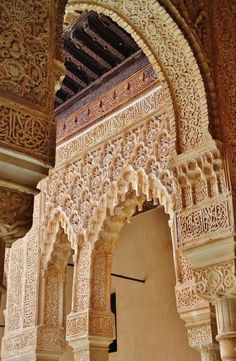 an ornate arch in the middle of a building