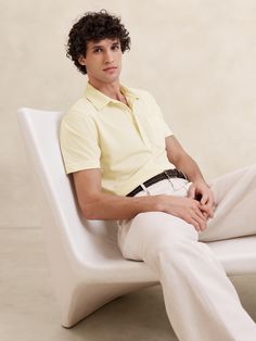 We updated the smart look and soft feel of our best-selling Luxury Touch fabric with a pique knit texture that uses mercerized cotton, a special process that results in ultra-smooth fibers for a dressed-up finish.  Polo collar with button-front closure.  Chest pocket.  Straight hem with side vents.  Standard fit.  Short sleeves.  Hip length.  Model: Size M, 6'2" (188cm). Yellow Dress Shirt Men Outfits, Yellow Formal Outfit Men, Men Yellow Shirt Outfits, Butter Color Outfit, Yellow Dress Shirt Men, Yellow Outfit Men, Yellow Shirt Men, Yellow Shirt Outfit, Grease Costume