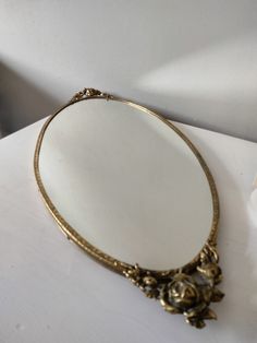 a mirror sitting on top of a white table