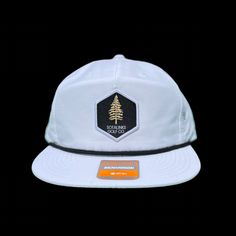 I don't know about you, but I'm always stuck in the pines. Punch it back to the fairway with this clean, classic look. Richardson Rope Hat with woven label. 85% Cotton, 15% Nylon Adjustable Snapback OSFM White Six-panel Snapback Hat For Outdoor Activities, White Baseball Cap For Hiking, Casual Snapback Hat With Flat Bill For Golf, Casual Flat Bill Snapback Hat For Golf, White Snapback Hat With Flat Brim For Outdoor Activities, Casual White Hat For Camping, White Outdoor Hat With Logo Patch, White Hat With Logo Patch For Outdoor, White Snapback Hat For Camping