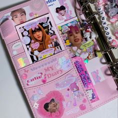 a pink binder with stickers on it