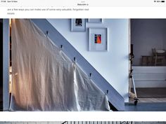 a stair case with pictures on the wall