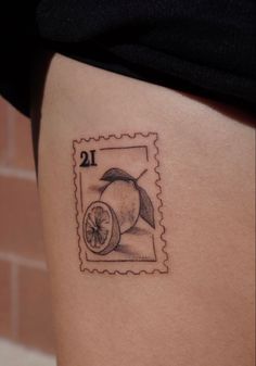 a stamp with an apple on it and the number twelve is shown in black ink