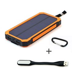 an orange and black solar charger next to a usb cable