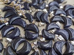 Made from man-made blue goldstone, these adorable moons come with a silver toned bail for easy stringing for necklaces, bracelets, and more. They are sold per randomly selected piece. Blue Goldstone, Moon Charm, Necklaces Bracelets, Silver Tone, Charms, Necklaces, Moon, Crystals, Silver