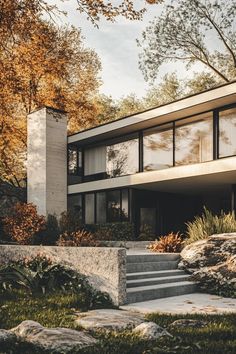 an architectural rendering of a modern house in the fall